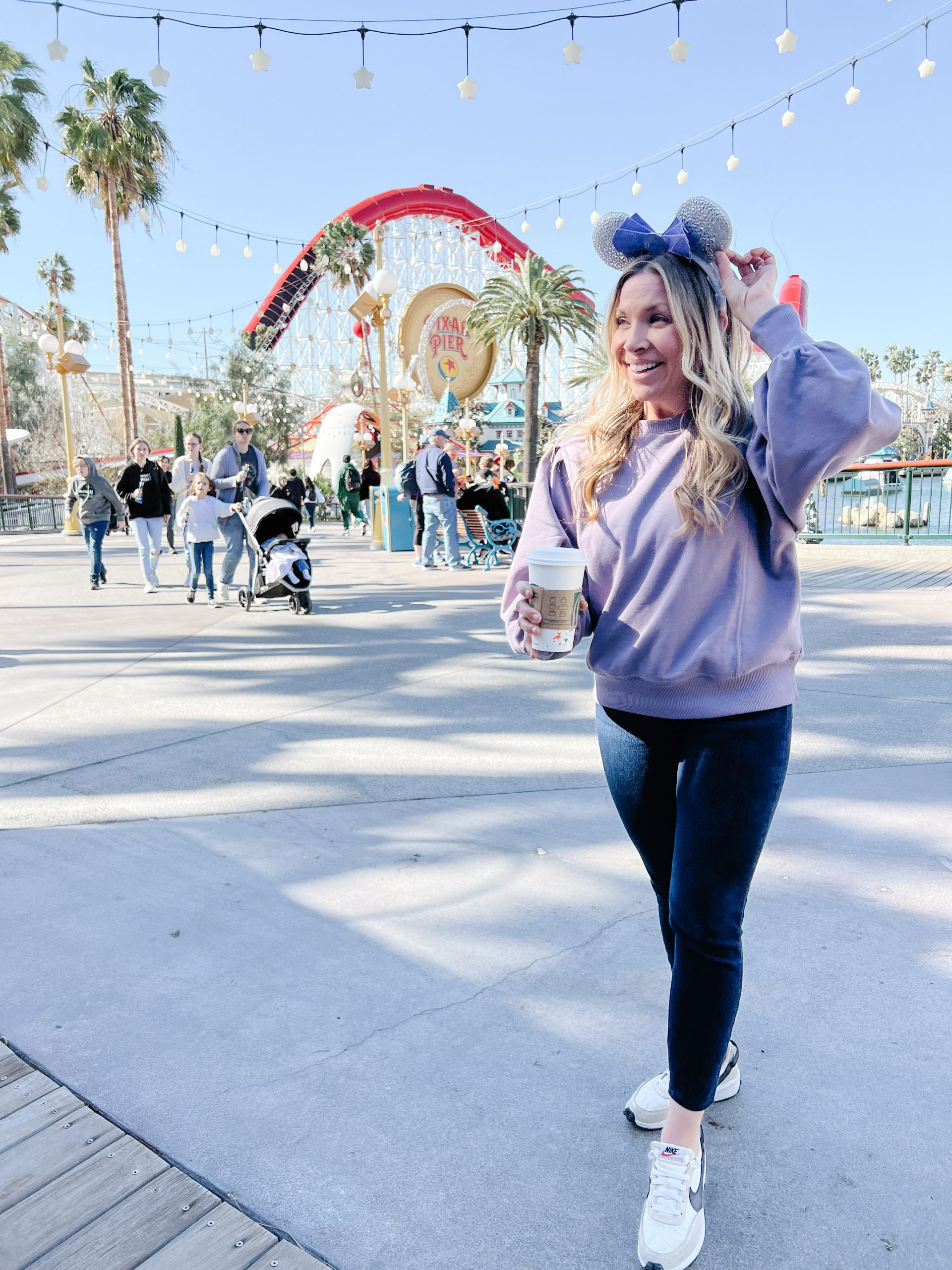 woman with minnie ears standing in California Adventure