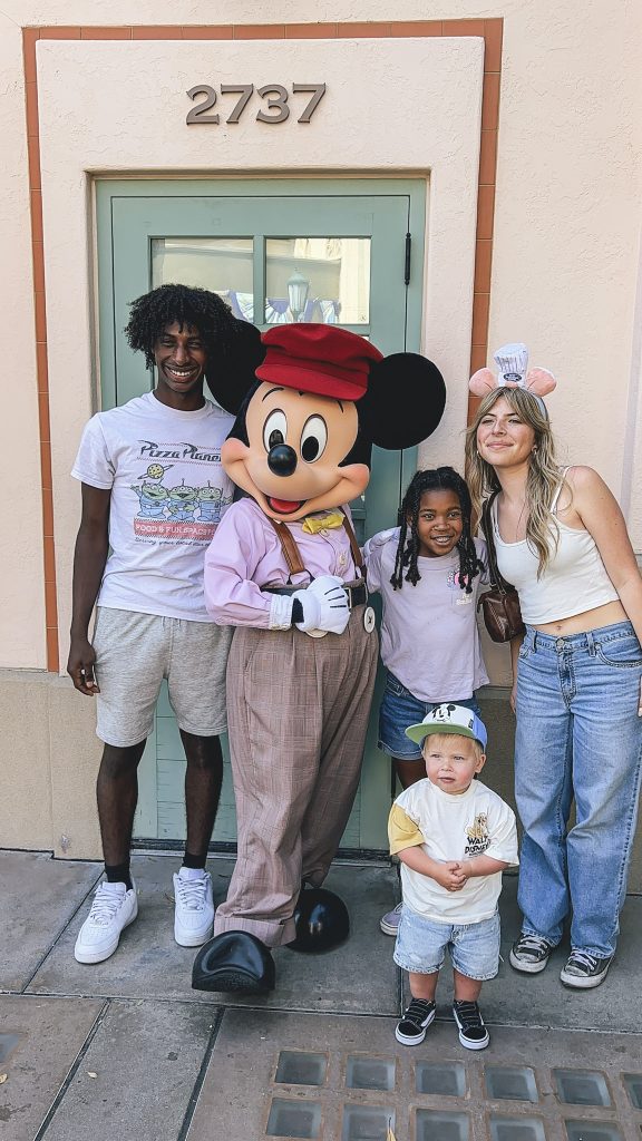 kids standing with Mickey Mouse in California Adventure