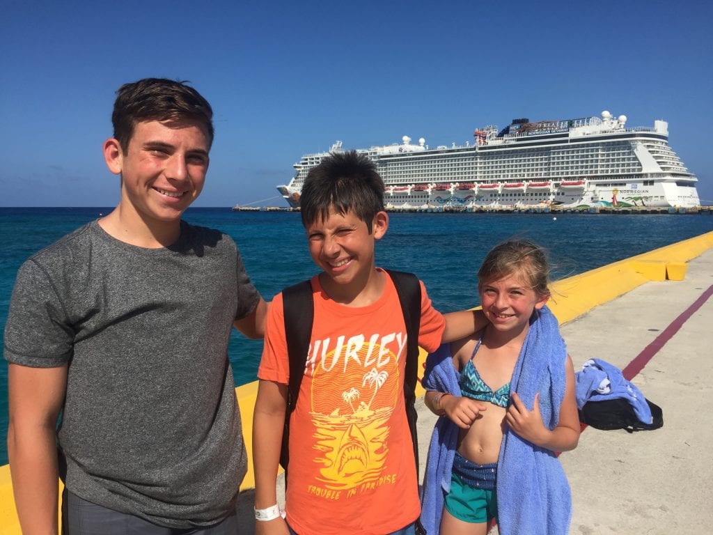 Family in front of Norwegian Getaway in Costa Maya